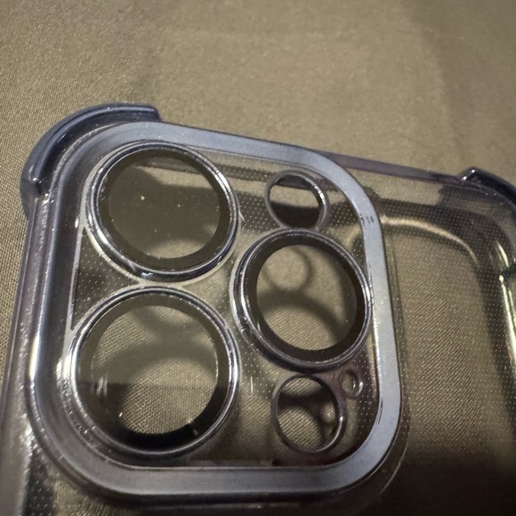 Clear Phone Case with Blue Accents For a 15 Pro Max. Spinning wheel in Center. - Picture 4 of 14